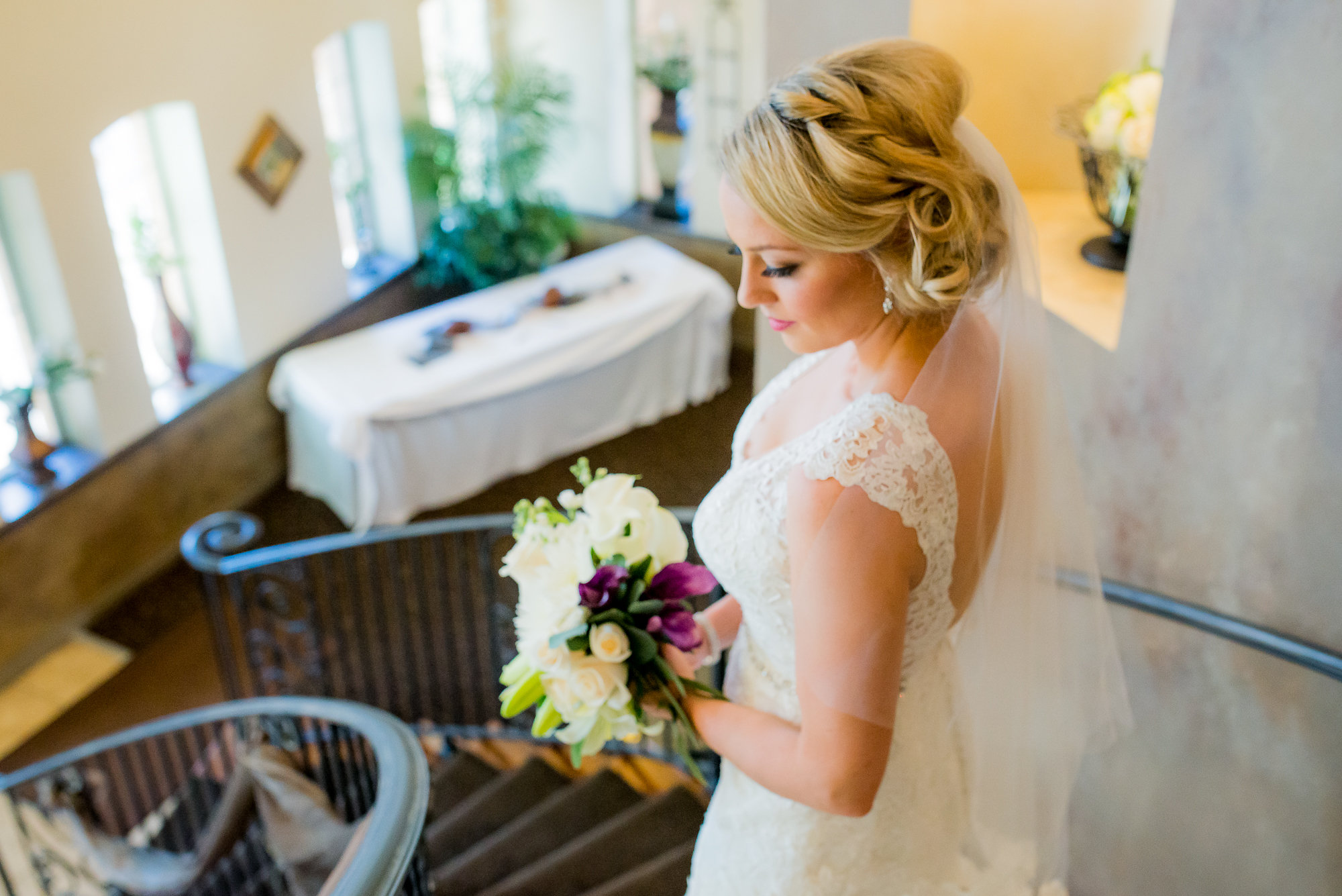 Bride on grand staircase at Bella Sera Event Center